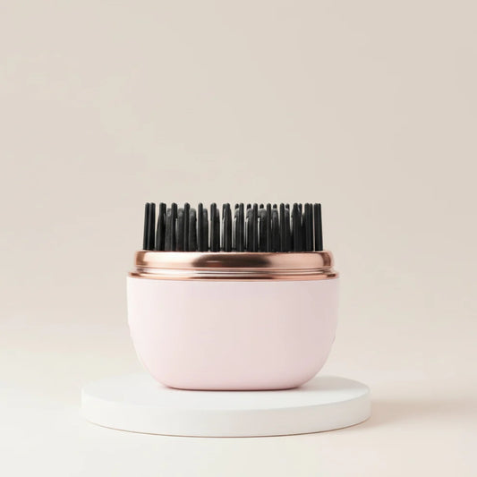 The Harmoniq Mini Pocket-Sized Cordless Heated Brush
