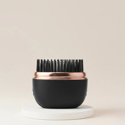 The Harmoniq Mini Pocket-Sized Cordless Heated Brush